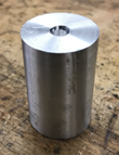 A silver can on a wood surface

Description automatically generated with low confidence