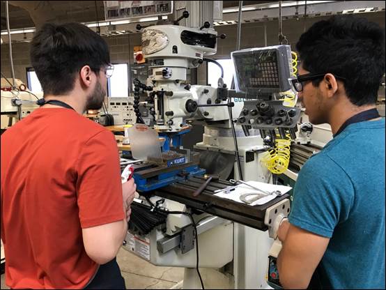 A picture containing person, indoor, microscope, working

Description automatically generated