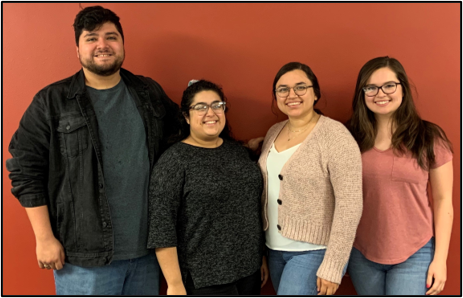 A group of people posing for a photo

Description automatically generated